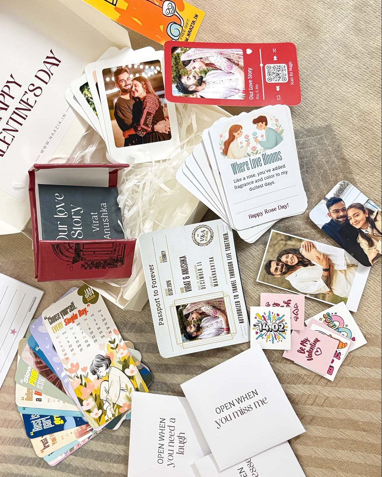 Collection of Valentine's Day cards and stationery items on a wooden surface