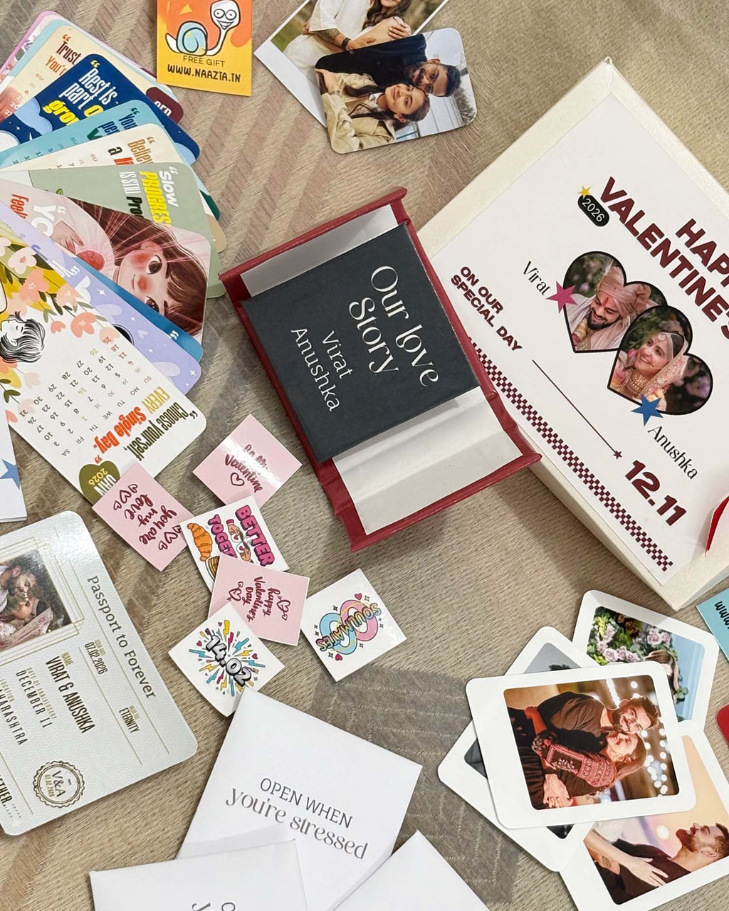 Collection of Valentine's Day cards and photo album on a wooden surface