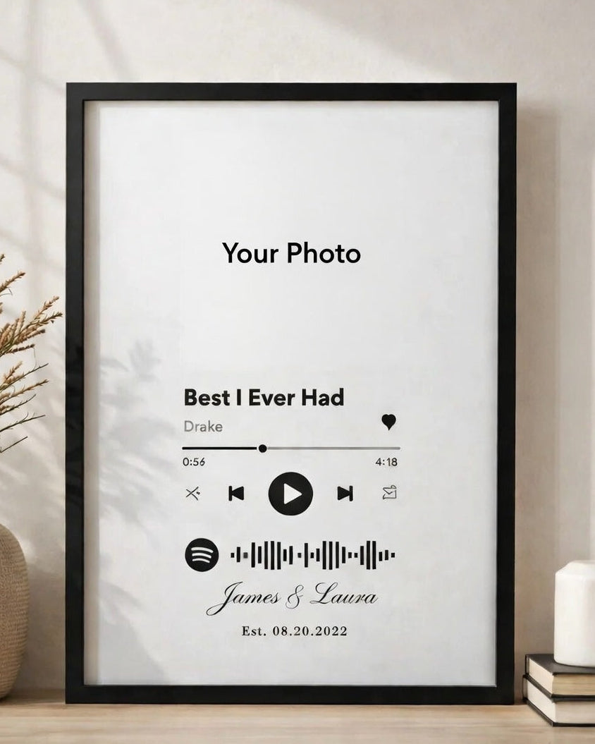 Framed artwork with music track design on a wall.