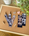 Film strip letters 'V' and 'W' on a cork board with photos and decorative items.