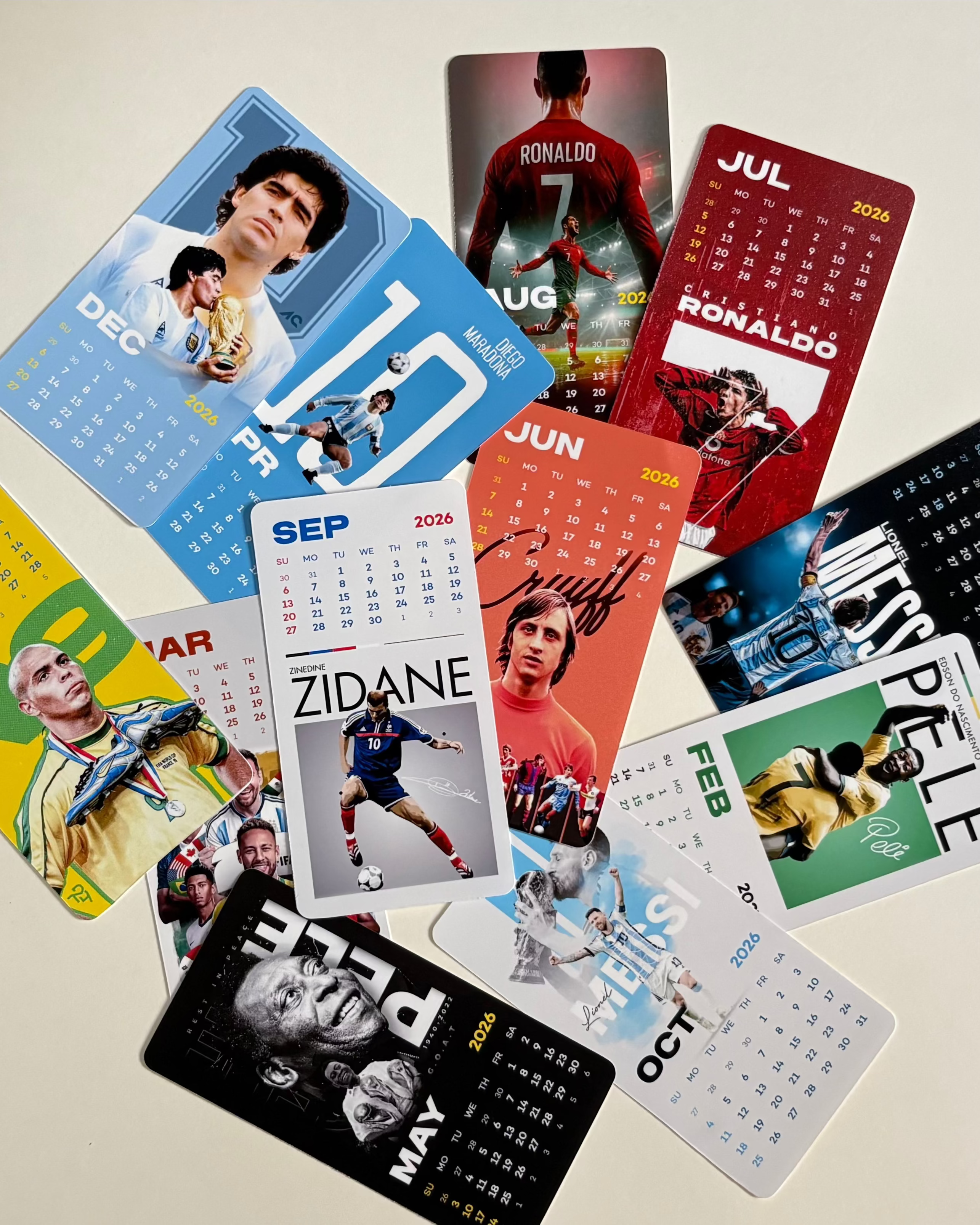 Collection of colorful calendars with various designs on a light background