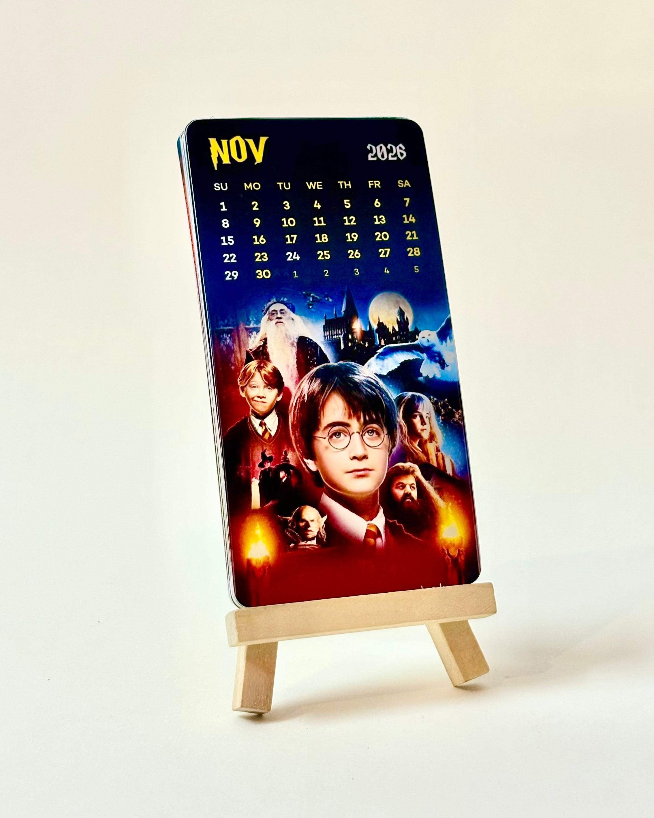 Calendar with Harry Potter design on a stand against a white background