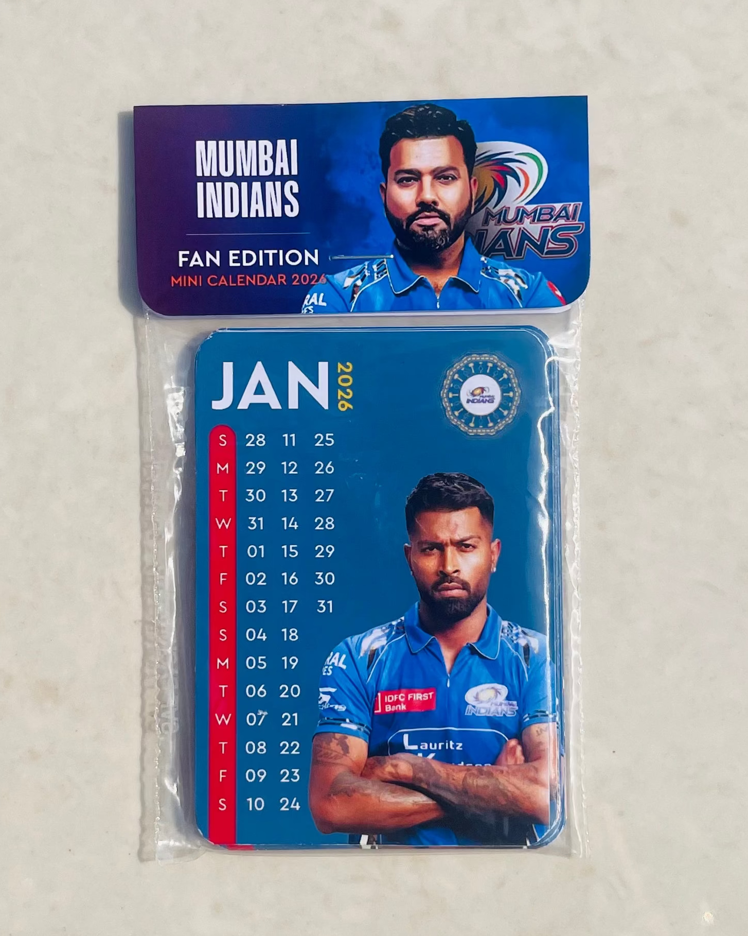 Packaged calendar with Mumbai Indians branding on a light gray background