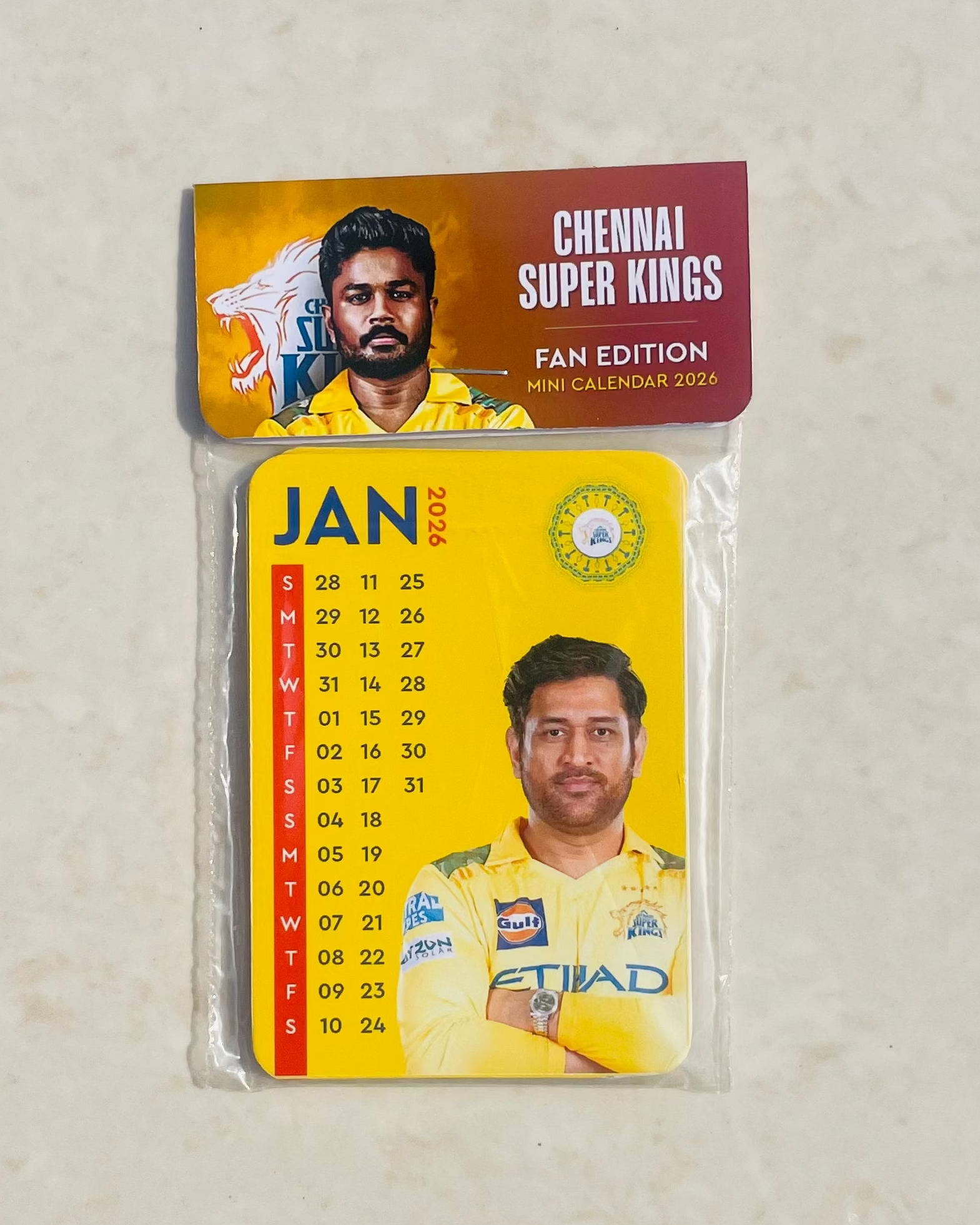 Calendar with Chennai Super Kings branding on a beige background