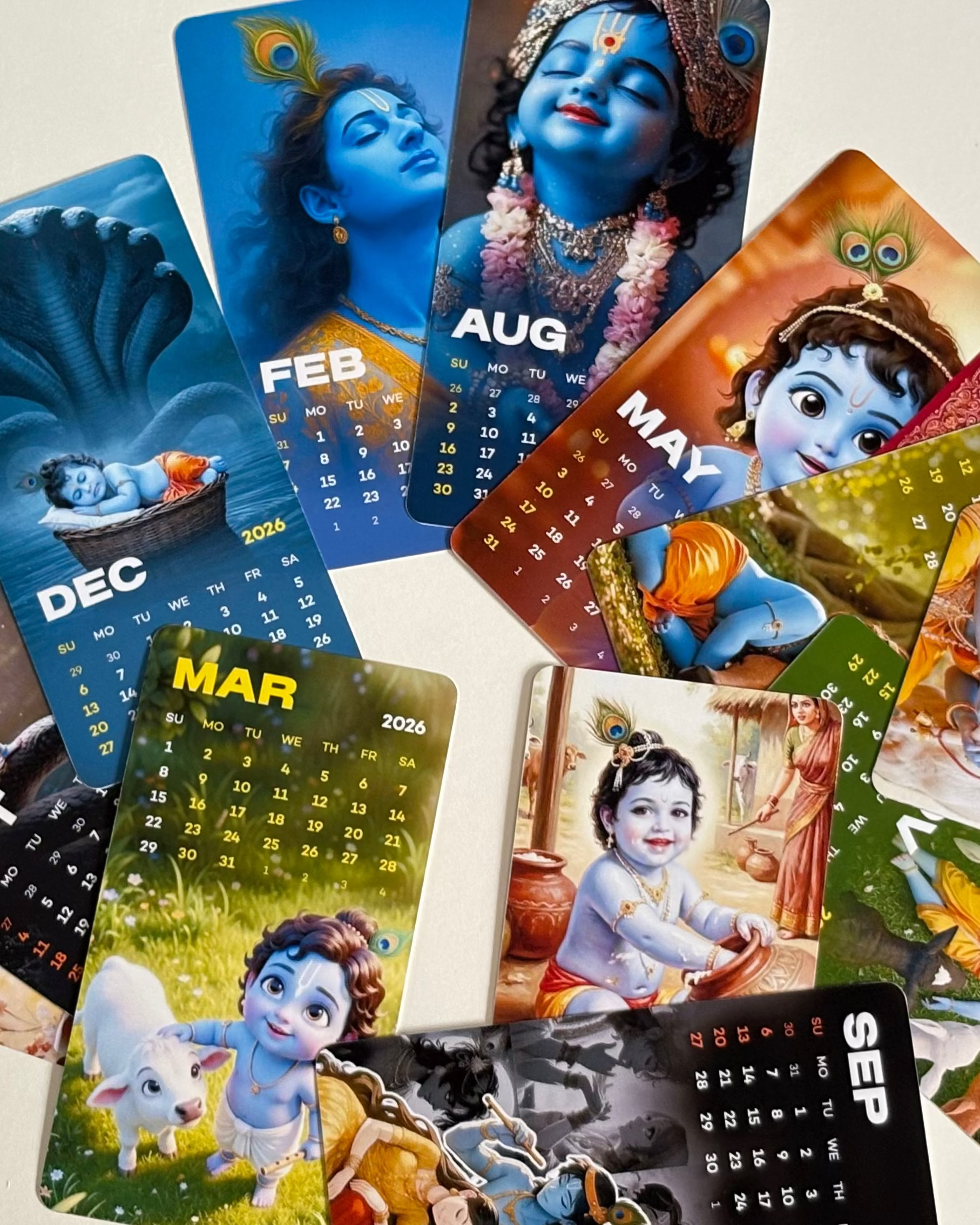 Collection of colorful calendar cards with character designs on a light background