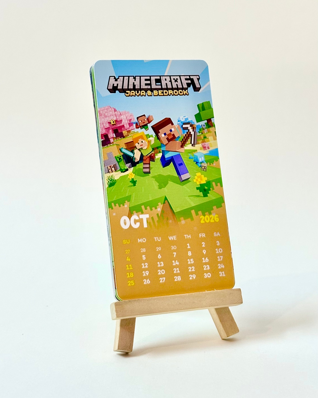 Calendar with Minecraft characters on a stand against a white background