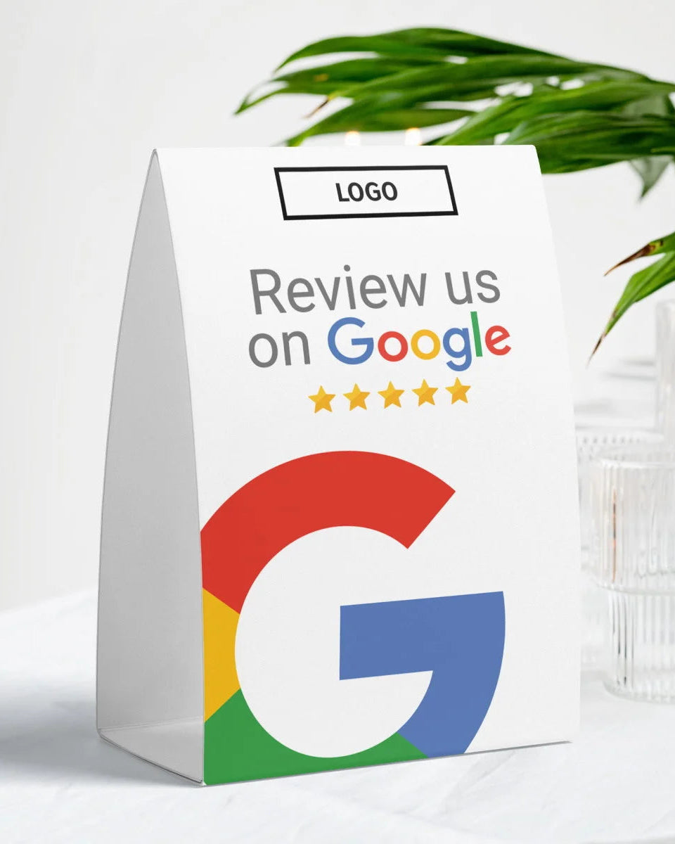 White paper bag with Google logo and text 'Review us on Google' on a light background