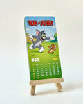 Tom and Jerry calendar on a stand with a white background